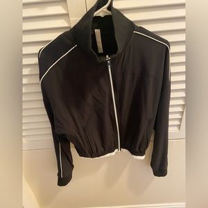 Athleta track jacket size XXS.  Fits like a XS/2.   Color black.